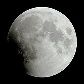 Full moon partially eclipsed by the shadow of the Earth