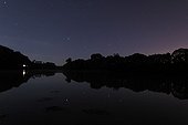 Mars Saturn Castor and Pollux reflected in a river France ; Saturn crosses the star cluster Cancer is close to Mars (lower right). Farther to the right, the stars Castor and Pollux of Gemini. The stars reflect in the calm waters of the river Odet. 