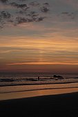 Sun pillar at sunset over the sea Britain France
