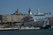 Ferry in the Marseille harbour in France ; In the background Basilique Notre-Dame-de-la-Garde