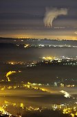 Fog sheet and Bugey nuclear power plant at night France