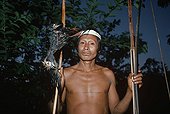 Matses Tribesman hunter with a Blue-throated piping guan Peru
