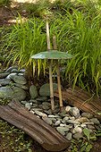 Garden lightning in middle of pebbles in a garden