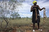 Aboriginal lady hunting sand monitors in Australia ; Warlpiri Aborginal community of Alice Spring