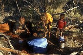 Honey ants gathering by Aboriginal ladies in Australia ; Warlpiri Aborginal community of Alice Spring