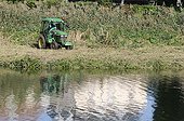 Grinding reed on gravel island River Allan France ; maintenance of the countryside in winter every 3 years 
