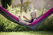 Child in a hammock in the spring France 