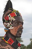 Portrait of a Karo man with body and facial paintings and a colorful headband, Omo river valley, Southern Ethiopia, Africa
