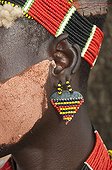 Colorful headband and earrings of a Karo man, Omo river valley, Southern Ethiopia, Africa