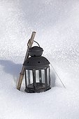 Lantern in a garden under snow