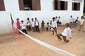 Children playing Katov in school in Laos ; The principle is to play with two teams separated by a net