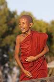 Young monk laughing Monastery Nyaungshwe Burma