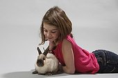Girl stroking a rabbit 