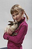 Girl carrying a rabbit 