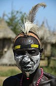 A chief of the Karo tribe wearing feathers in a headband and white paint on his face, Kolcho, South Omo Valley, Ethiopia, Africa