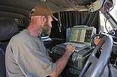 Veterinarian of an NGO involved in his vehicle Namibia ; Philip (Flip) Sander, veterinarian for the NGO "Desert Lion", works in the northwest of the country. Here, his vehicle office laboratory. 