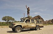 Veterinarian in the footsteps of Lions in Namibia ; Philip (Flip) Sander, veterinarian for the NGO "Desert Lion" listens for signals from satellite collars.