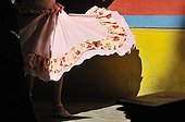 Swinging dress in front of a colorful wall, performance of the traditional Cahacarera dance at El Caminito Street, dancers wearing gaucho clothing, tourist attraction in the former harbour district of La Boca, Buenos Aires, Argentina, South America