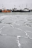Ice floes and fishing boats in the port of Sassnitz on Ruegen Island, Mecklenburg-Western Pomerania, Germany, Europe