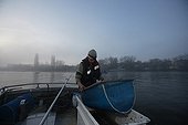 Fisherman & net on his Boat for alevin Eel fish Loire river