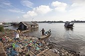 Boat loaded with supplies and trash Tonle sap Cambodia