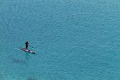 Man practicing Stand up paddle surfing in Cape Taillat 