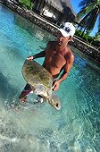 Healer and Sea turtle wounded Moorea French Polynesia ; The association Te Mana o Te Moana, based at the Intercontinental Hotel, treats turtles brought by fishermen or customs 