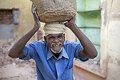Mason removing rubble District Tamil Puducherry India