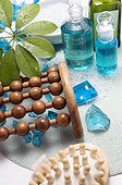 Wooden massagers and essential oil bottles close-up
