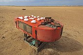 Sale of natural salt on the Atlantic coast in Namibia ; Small stand selling salt roadside on the Atlantic coast in the region of Cape Cross. These stands is a small jar to collect the payment of purchased salt free service .