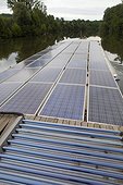 Solar panels on a barge on the River Lot France 