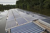 Solar panels on a barge on the River Lot France 