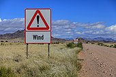 Sign indicating the presence of strong wind Namibia  ; track bordering the reserve NamibRand 