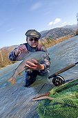 Fly fishing for grayling River Drau Hight Tyrol Austria ; Fly fishing on alpine river 