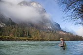 Fly fishing for grayling River Drau Hight Tyrol Austria ; Fly fishing on alpine river 