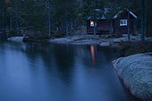 Cabin on a lake at dusk Skuleskogen Sweden 