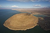 Aerial view of Nabuyatom Crater South of Lake Turkana Kenya ; It is the world’s largest desert lake and the world’s largest alkaline lake. Rocks in the surrounding area are predominantly volcanic.