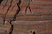 Layers of red clay in volcanic formation - Brittany France  ; Paleozoic, Cambrian Ordovician boundary, 472 million years ago.