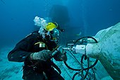 Cleaning high pressure air - Aquarius Reef Base Florida ; umbilical diver cleaning the high pressure air reserve