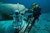 Cleaning high pressure air - Aquarius Reef Base Florida ; umbilical diver cleaning the high pressure air reserve