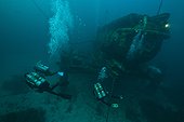 Divers near the station - Aquarius Reef Base Florida ; Aquanauts (nitrogen saturated divers from the habitat) swim from the station to their working place, which can be several hundered meters away from the station. The Aquanauts have no decompression limits in these depths. 3 High-pressure air supplied undersea stations located as far as 1000' away from the habitat, allowing divers to communicate to the habitat and refill their scuba tanks while working on nearby sandy or coral reef areas.