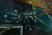 Aquanauts  enter the wet porch - Aquarius Reef Base Florida ; Aquanauts Dr. Chris Martens (l) and Dr. Niels Lindquist (r) enter the wet porch at the end of a night dive
