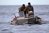 Walrus hunters in a boat - Chukotka Russia 