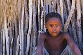 Bushman child in front of a hut - Kalahari Botswana 