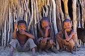 Bushman children in front of a hut - Kalahari Botswana 