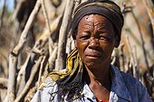 Bushman woman in front of a hut - Kalahari Botswana 
