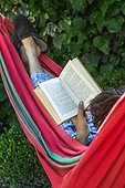 Reading in a garden hammock 