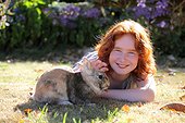 Girl with her dwarf rabbit