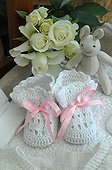 Birth Announcement with slippers and stuffed rabbit 