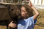 Girl and young camel in Al Ain camel market -UAE